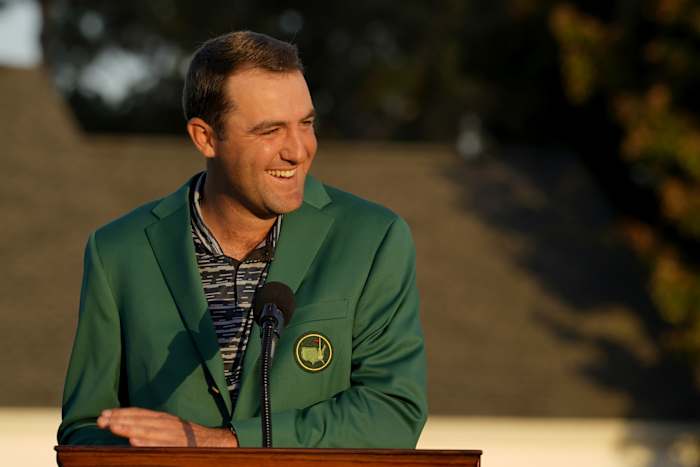 Apr 10, 2022; Augusta, Georgia, USA; Scottie Scheffler reacts at the podium while wearing the green jacket during the final round of the Masters Tournament at Augusta National Golf Club. Mandatory Credit: Katie Goodale-Augusta Chronicle/USA TODAY Sports